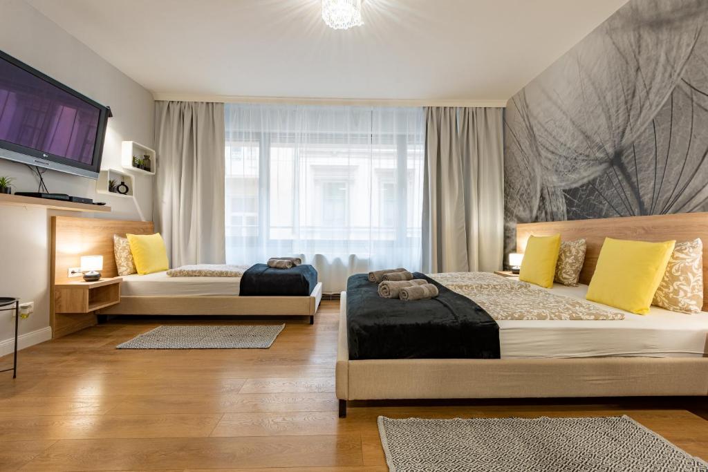 Postel nebo postele na pokoji v ubytování Budapest Holidays Apartments & Spa