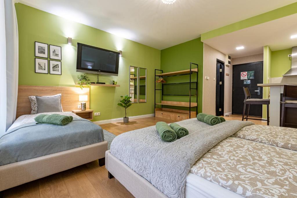 Postel nebo postele na pokoji v ubytování Budapest Holidays Apartments & Spa