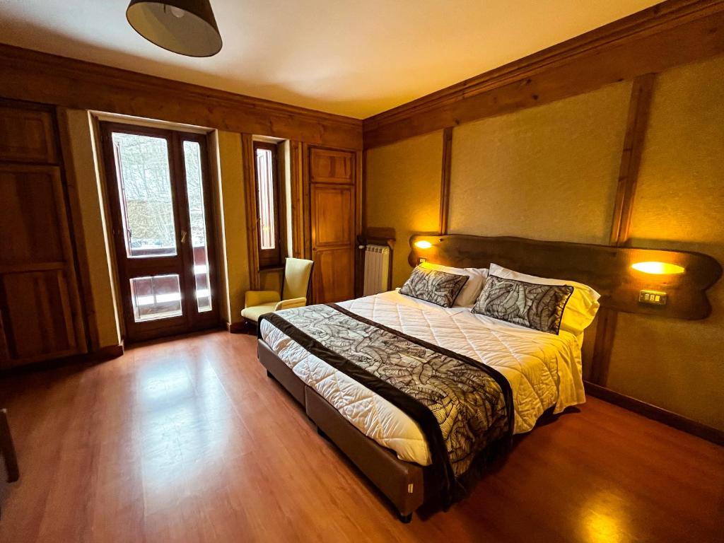 Postel nebo postele na pokoji v ubytování Hotel Togo Monte Terminillo