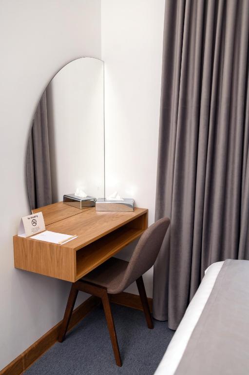 Postel nebo postele na pokoji v ubytování Revive Boutique Hotel