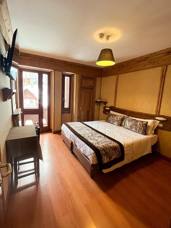 Postel nebo postele na pokoji v ubytování Hotel Togo Monte Terminillo