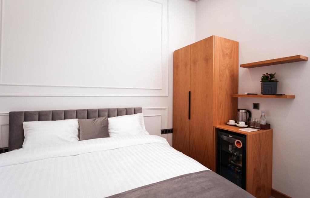 Postel nebo postele na pokoji v ubytování Revive Boutique Hotel