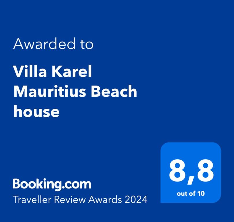 Riambel的住宿－Villa Karel Mauritius Beach house，手机的屏幕,手机的文本被授予别墅业力