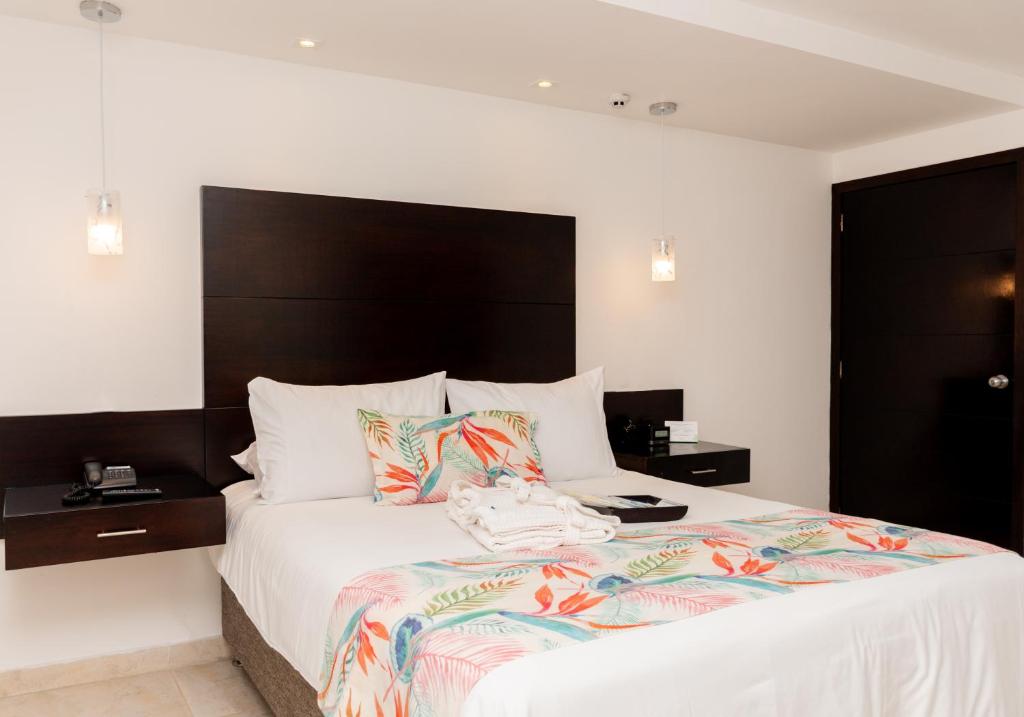 Postel nebo postele na pokoji v ubytování Hotel Capilla del Mar