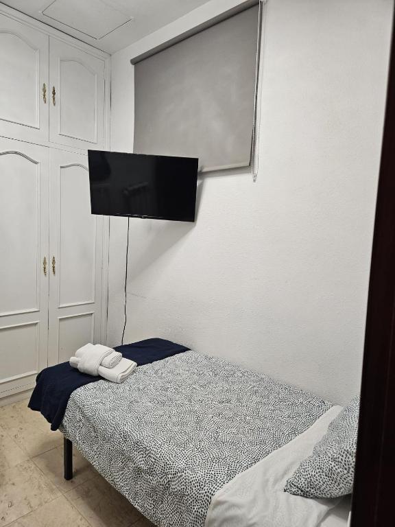Postel nebo postele na pokoji v ubytování Hostal Alfaro