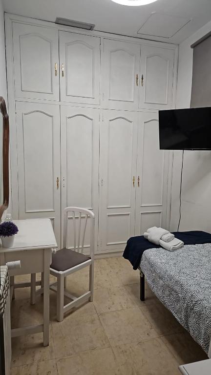 Postel nebo postele na pokoji v ubytování Hostal Alfaro