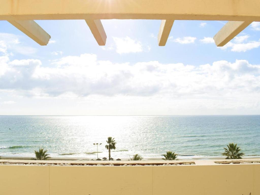 a view of the ocean from the balcony of a resort at Magnífico ático frente al mar en Ricón de la Victoria in Rincón de la Victoria