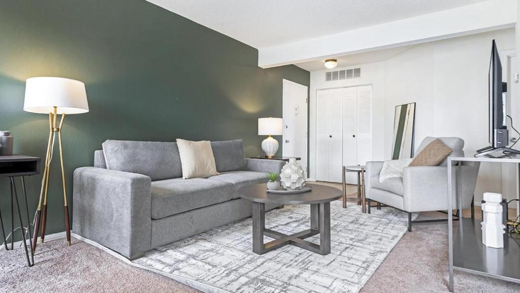 a living room with a couch and a table at Landing - Modern Apartment with Amazing Amenities (ID9305X02) in Ballwin