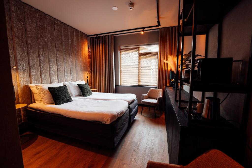 Postel nebo postele na pokoji v ubytování Boutique Hotel, Restaurant & Wellness Westerburcht
