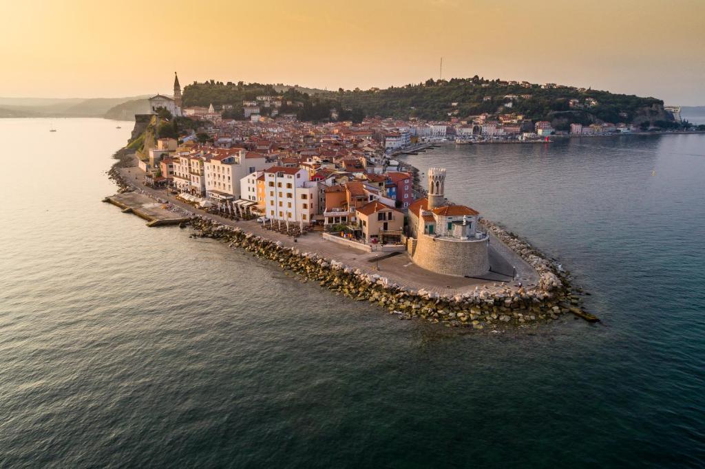an aerial view of a small island in the water at Hotel Piran in Piran