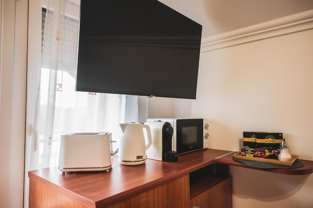TV a/nebo společenská místnost v ubytování Termálfürdő Apartman Igal 2 perc-130 méter a fürdőtől