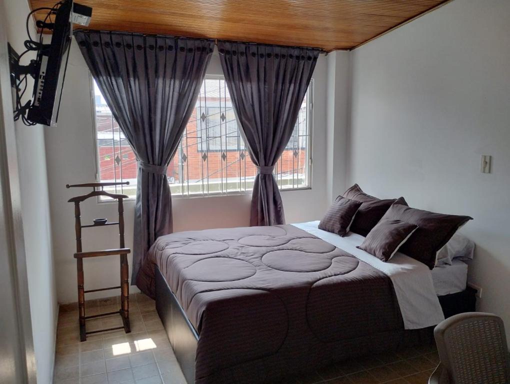 Postel nebo postele na pokoji v ubytování Prana House Bogotá 2.0
