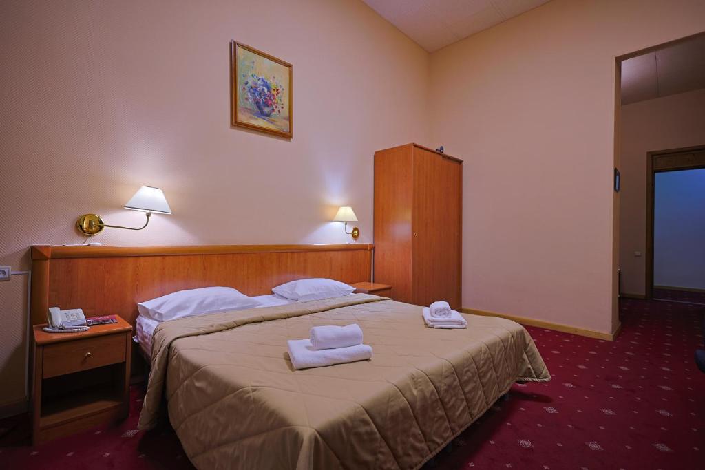 Postel nebo postele na pokoji v ubytování Araks Hotel Complex