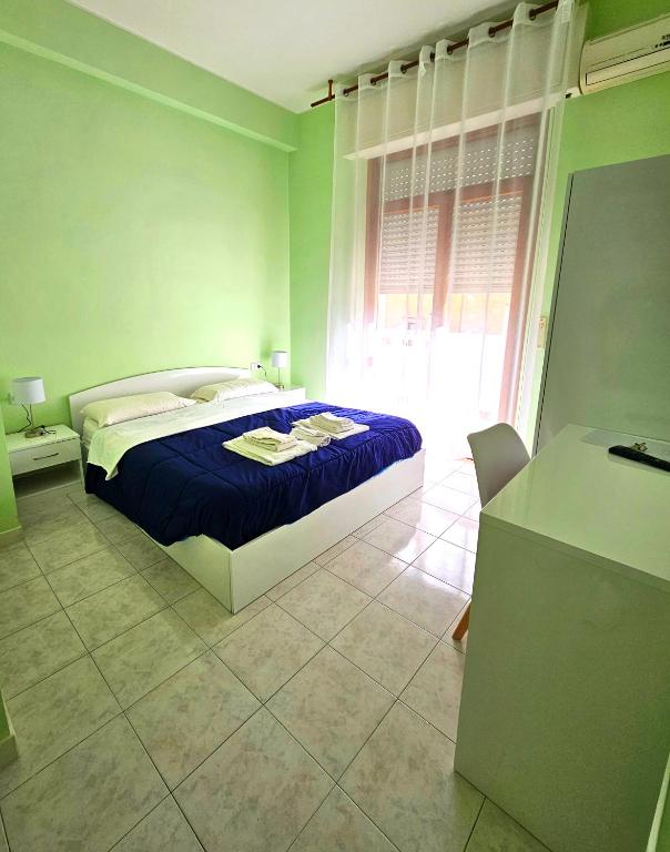 Postel nebo postele na pokoji v ubytování Mammasisi Rooms