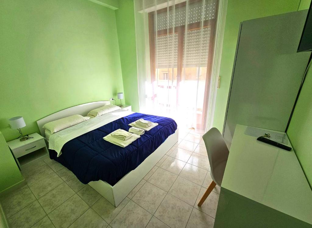 Postel nebo postele na pokoji v ubytování Mammasisi Rooms