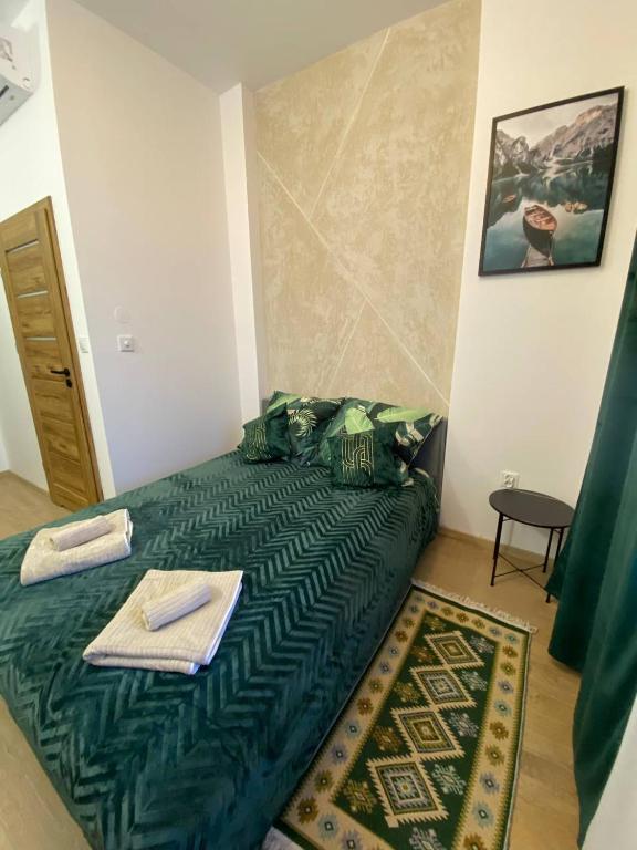 Łóżko lub łóżka w pokoju w obiekcie MH Apartments Centrum