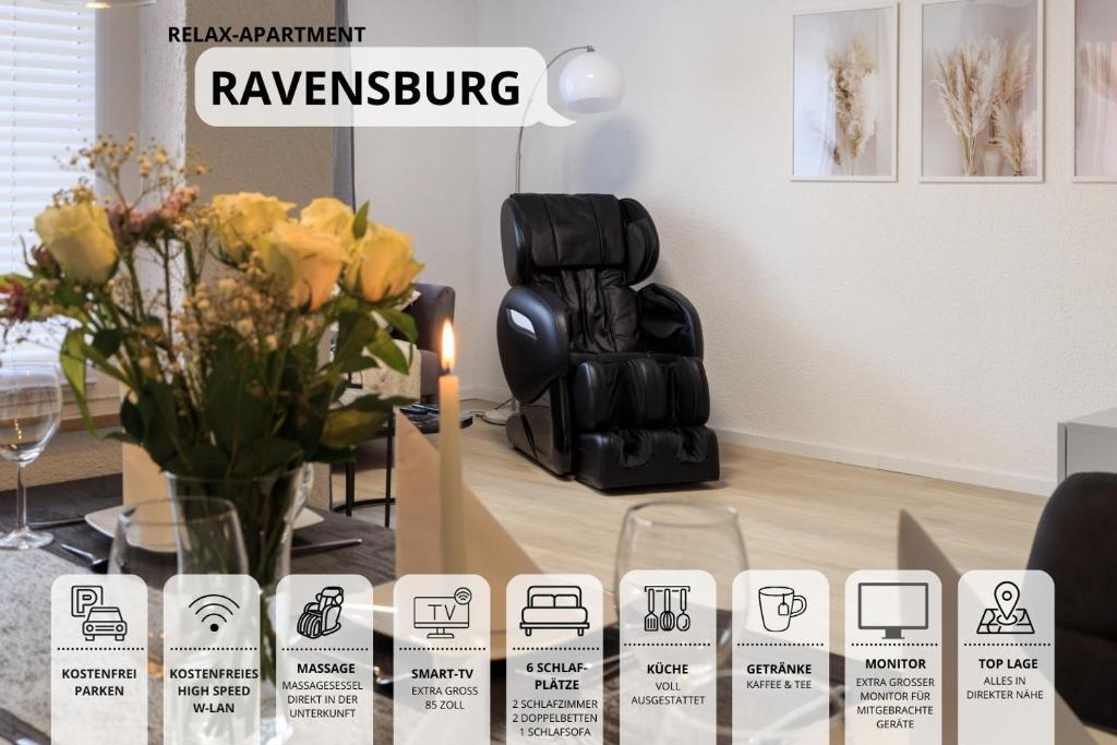 a table with a vase of flowers and a chair at Relax-Apartment-One Ravensburg in Ravensburg