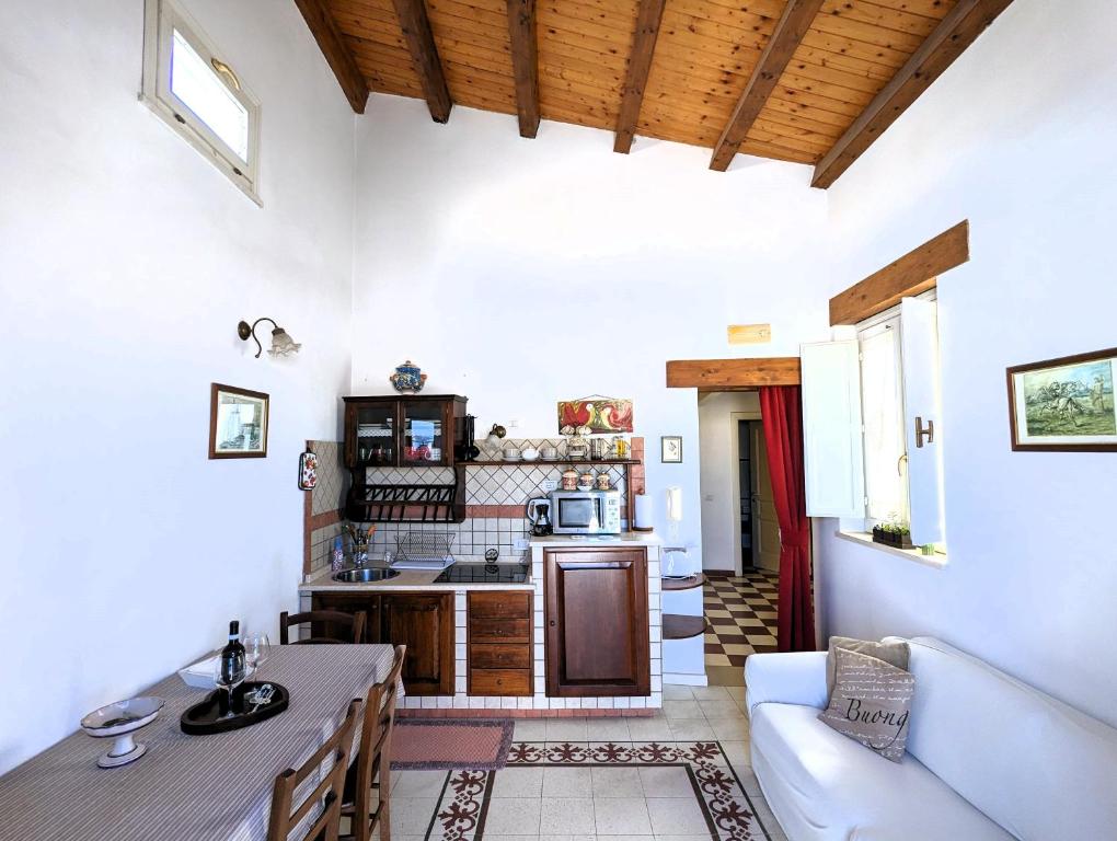 A kitchen or kitchenette at La Casa Delle Fate