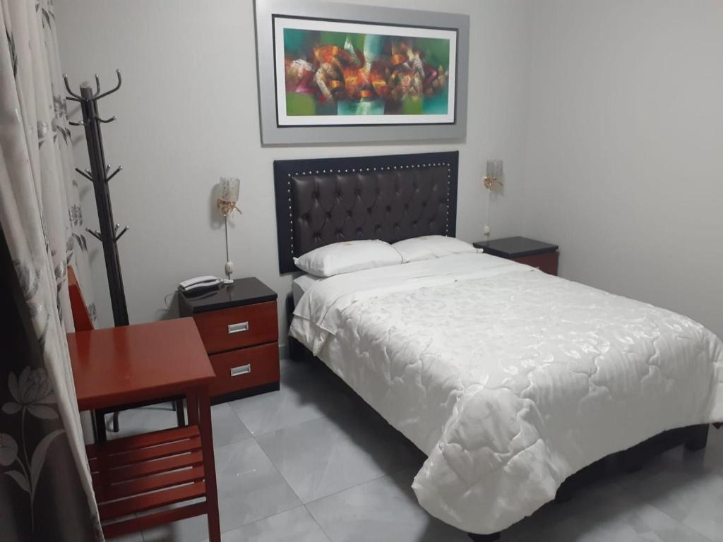 Postel nebo postele na pokoji v ubytování HOTEL REAL PALACE CHURIN
