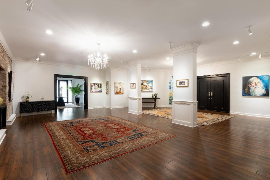 a large room with a rug on the floor at The Vendue, Downtown Art Hotel in Charleston