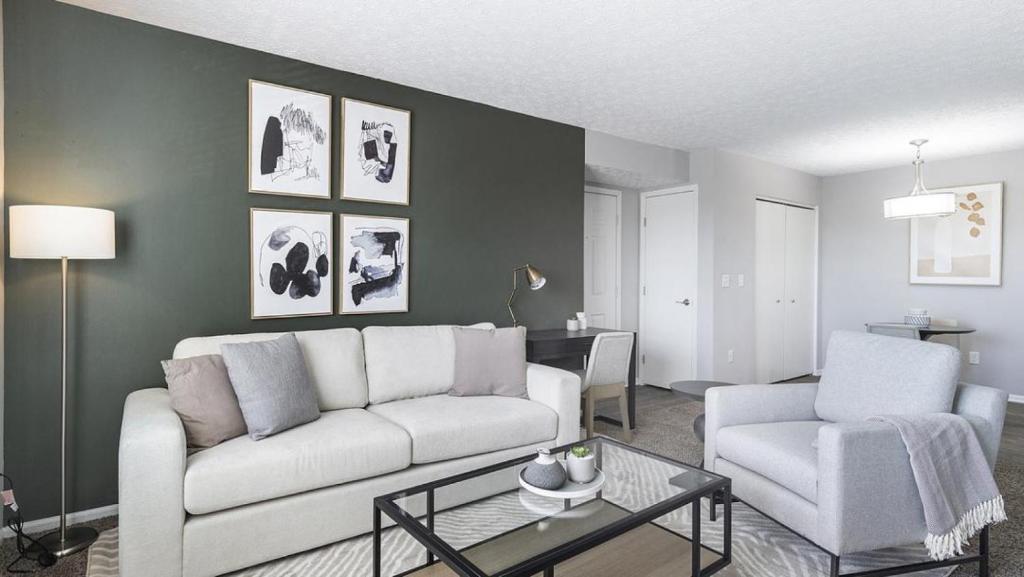 a living room with a white couch and a chair at Landing - Modern Apartment with Amazing Amenities (ID9303X46) in Lewis Center