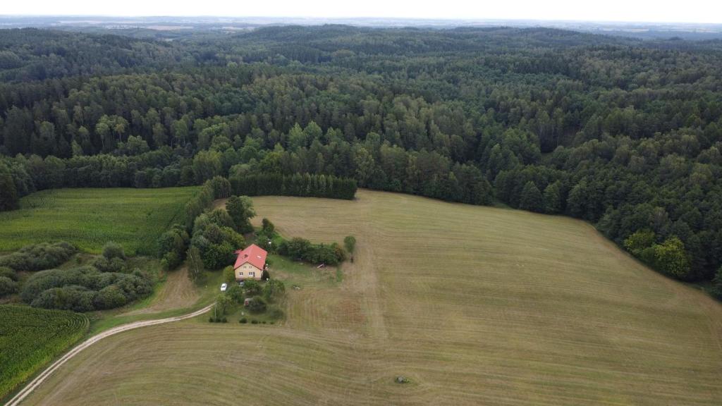 an aerial view of a house in a field at Dom na Warmii 