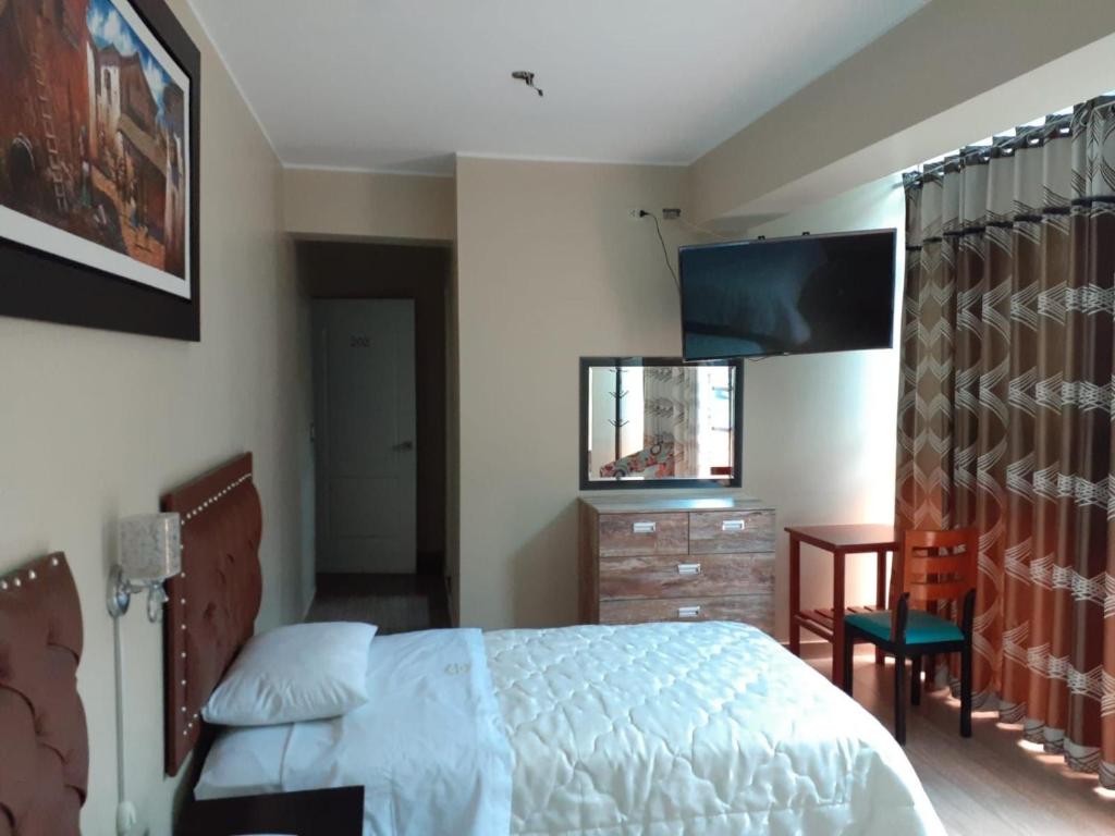 Postel nebo postele na pokoji v ubytování HOTEL REAL PALACE CHURIN