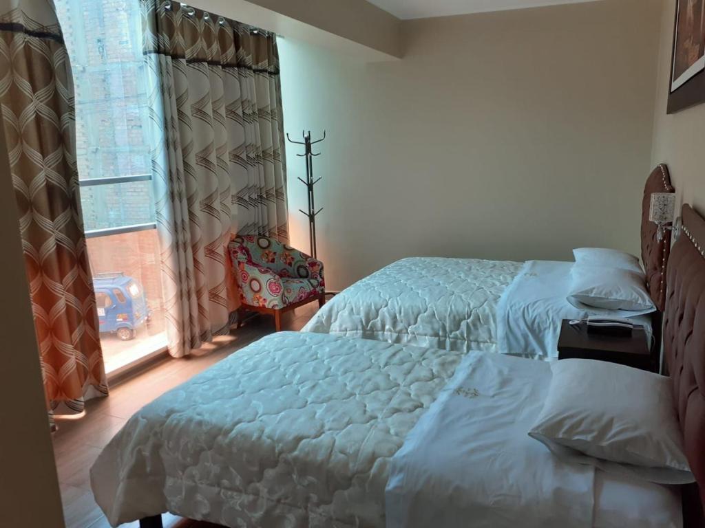 Postel nebo postele na pokoji v ubytování HOTEL REAL PALACE CHURIN