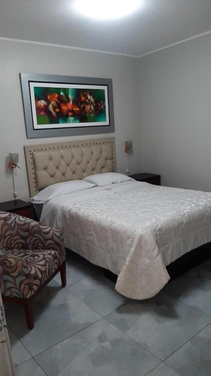 Postel nebo postele na pokoji v ubytování HOTEL REAL PALACE CHURIN