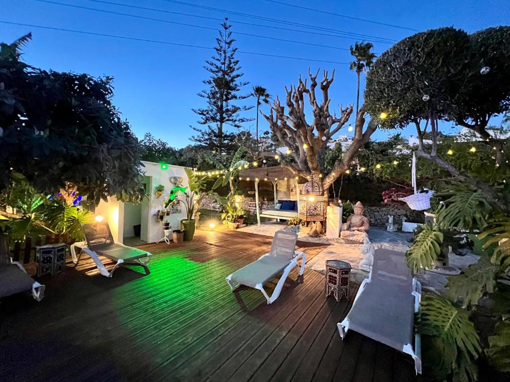 a patio with white chairs and tables and a tree at Hotel Altea Paradise 1917 - Adults Only in Altea