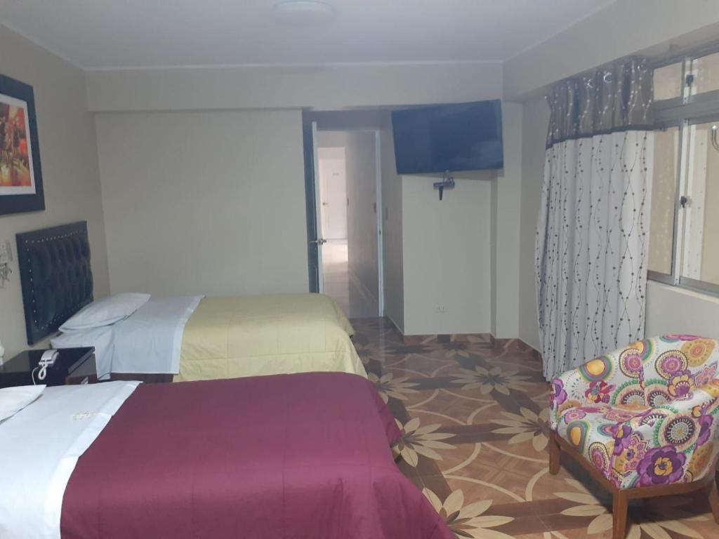 Postel nebo postele na pokoji v ubytování HOTEL REAL PALACE CHURIN