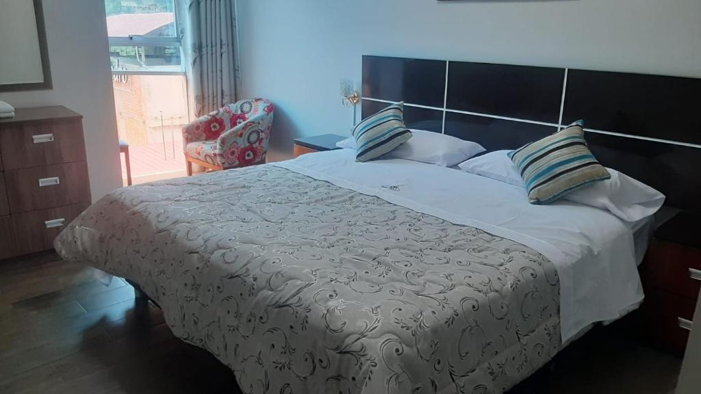 Postel nebo postele na pokoji v ubytování HOTEL REAL PALACE CHURIN