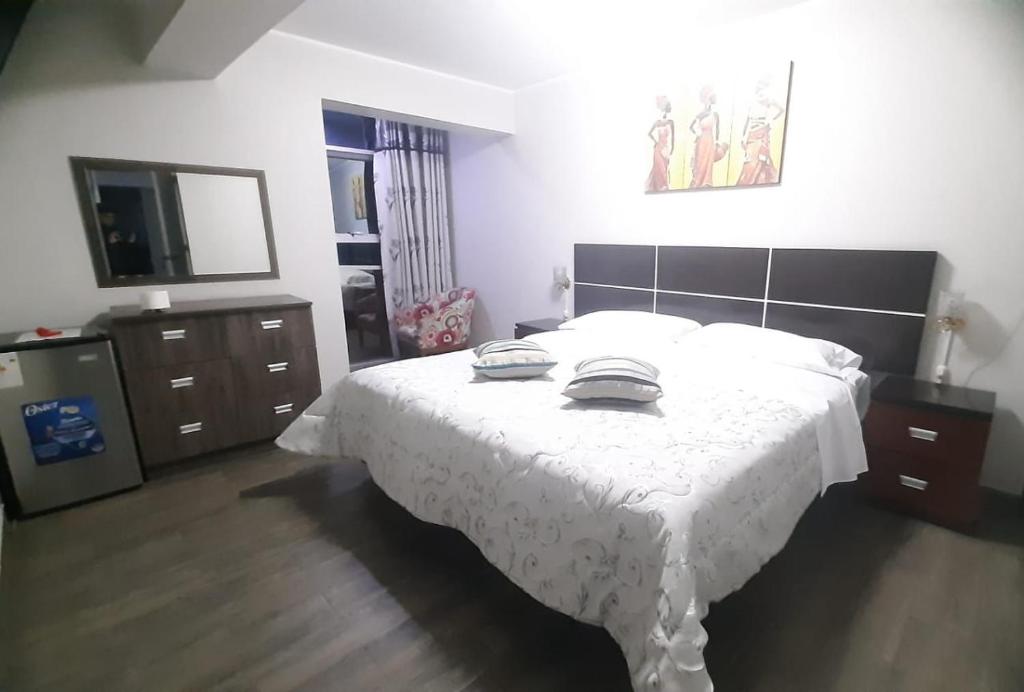 Postel nebo postele na pokoji v ubytování HOTEL REAL PALACE CHURIN