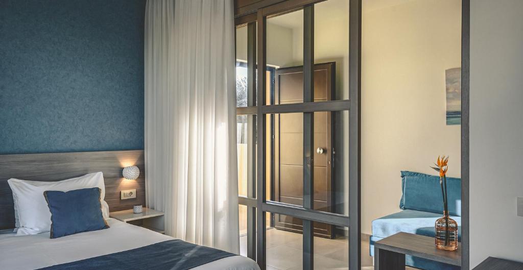 Postel nebo postele na pokoji v ubytování Althea Village - Family Hotel