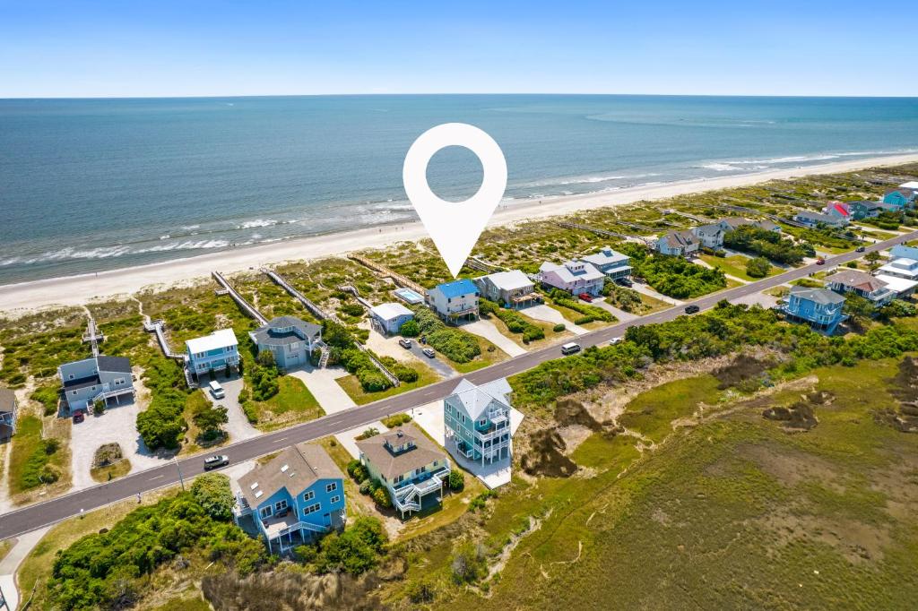 an aerial view of a resort with a map of the beach at A Coconut Hut Brunswick Vacation Rentals in Oak Island