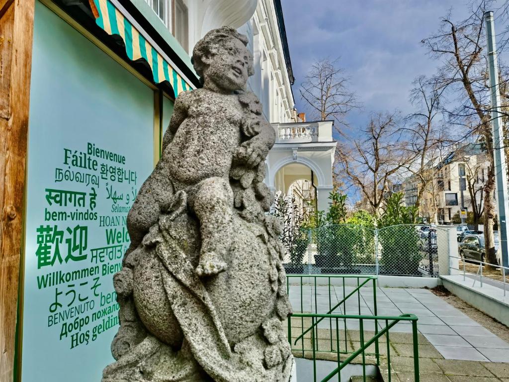 a statue in front of a building with a building at Sievering18 A-B in Vienna