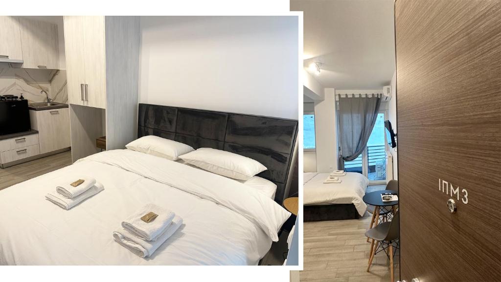 a bedroom with a bed with two towels on it at Brand new studios IPM1-2-3-4 in Larisa