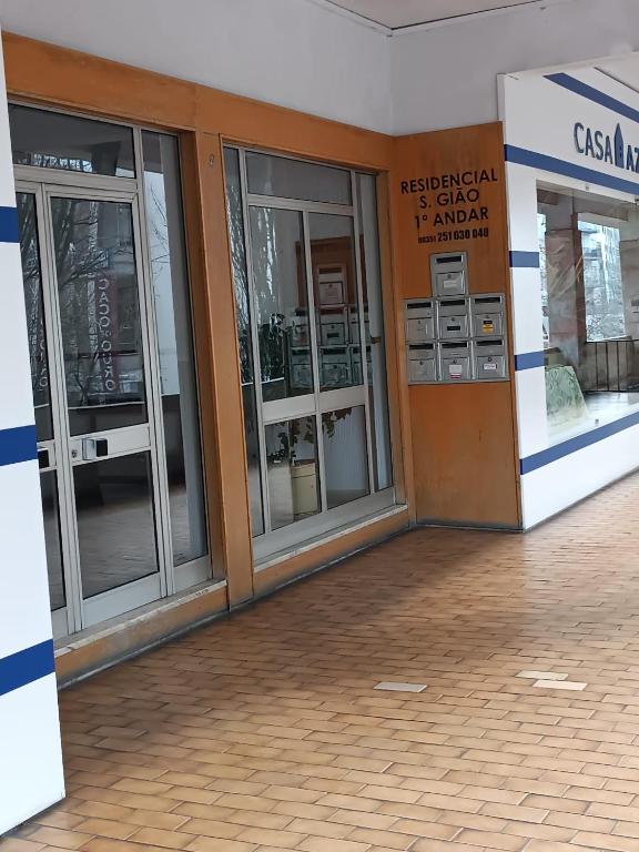 an entrance to a building with glass doors at Residencial S. Gião in Valença