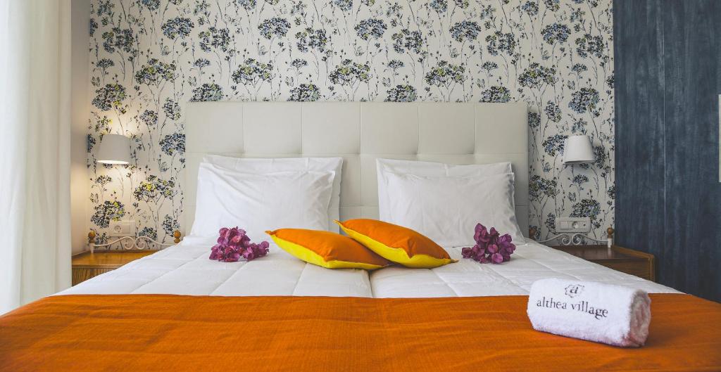Postel nebo postele na pokoji v ubytování Althea Village - Family Hotel