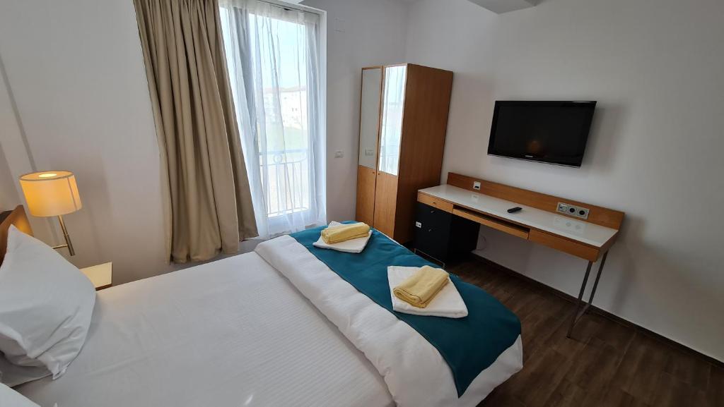 Postel nebo postele na pokoji v ubytování Jafar Resort 6