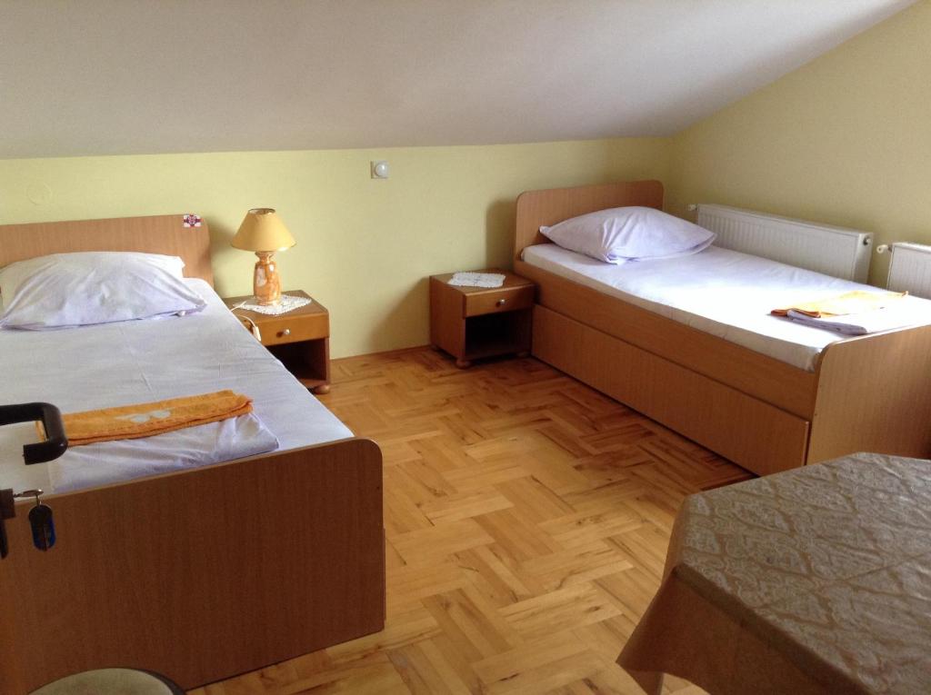 Postel nebo postele na pokoji v ubytování Pansion Velickovic