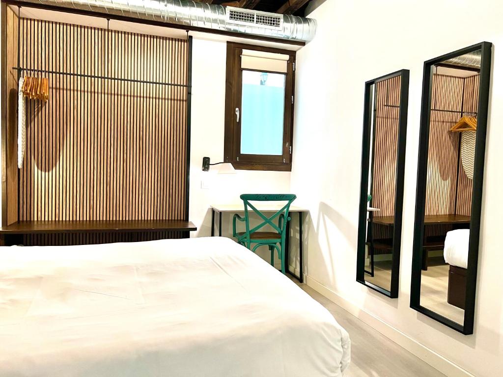 Posteľ alebo postele v izbe v ubytovaní Apartamentos Real Suites Realejo