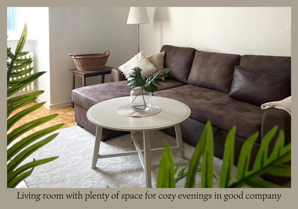 a living room with plenty of space for cozy events in good company at Urban Retreat - Central and Historic with Private Parking in Würzburg