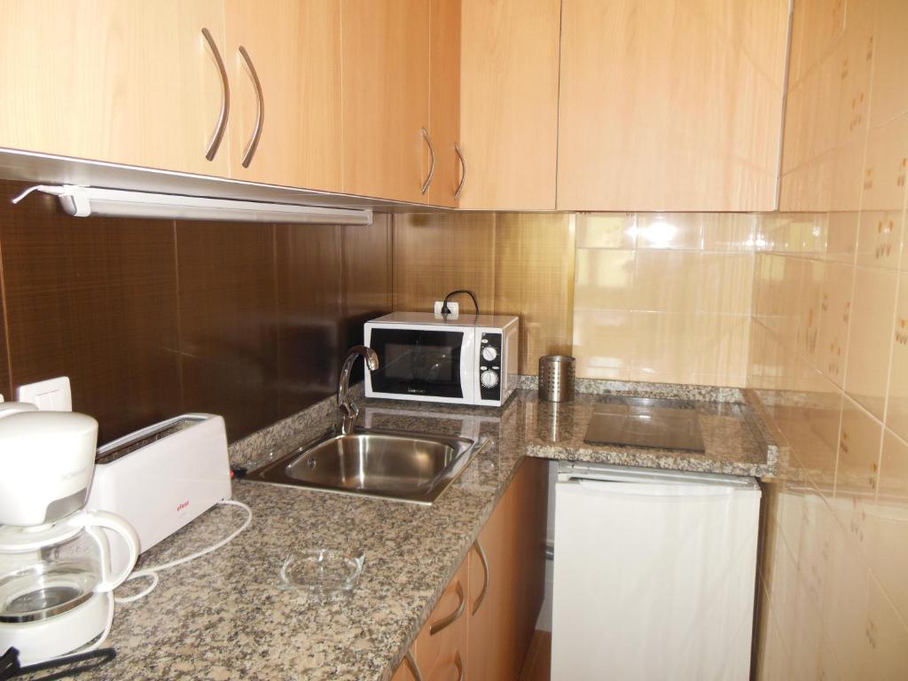 Kuchyň nebo kuchyňský kout v ubytování Apartamentos Grifovacances Canigou