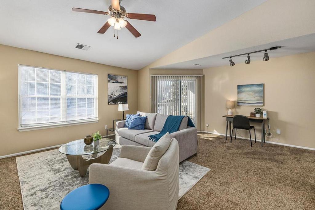 a living room with a couch and a ceiling fan at Landing - Modern Apartment with Amazing Amenities (ID8457) in Peerless Park