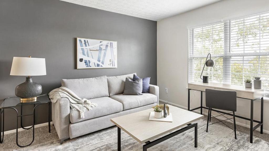 a living room with a couch and a table at Landing - Modern Apartment with Amazing Amenities (ID3447X43) in Lewis Center
