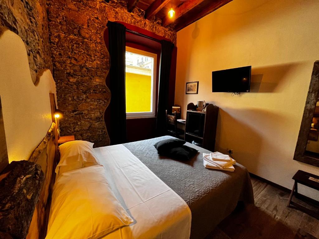TV a/nebo společenská místnost v ubytování La Taverna del Metallo Rooms