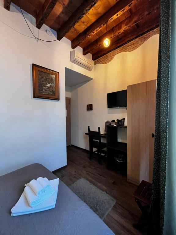 TV a/nebo společenská místnost v ubytování La Taverna del Metallo Rooms