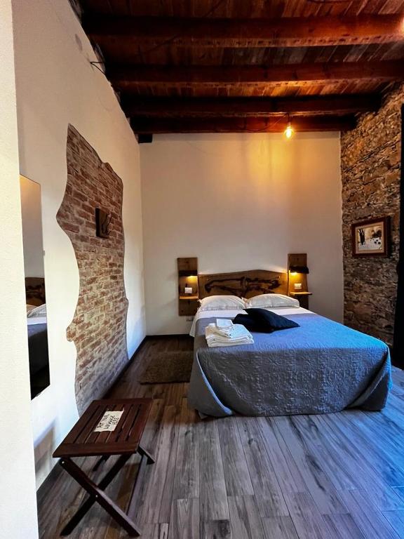 Postel nebo postele na pokoji v ubytování La Taverna del Metallo Rooms