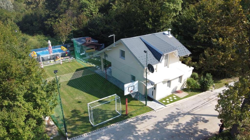 an aerial view of a house with a soccer field at Vikendica VILLA A1 in Banja Luka